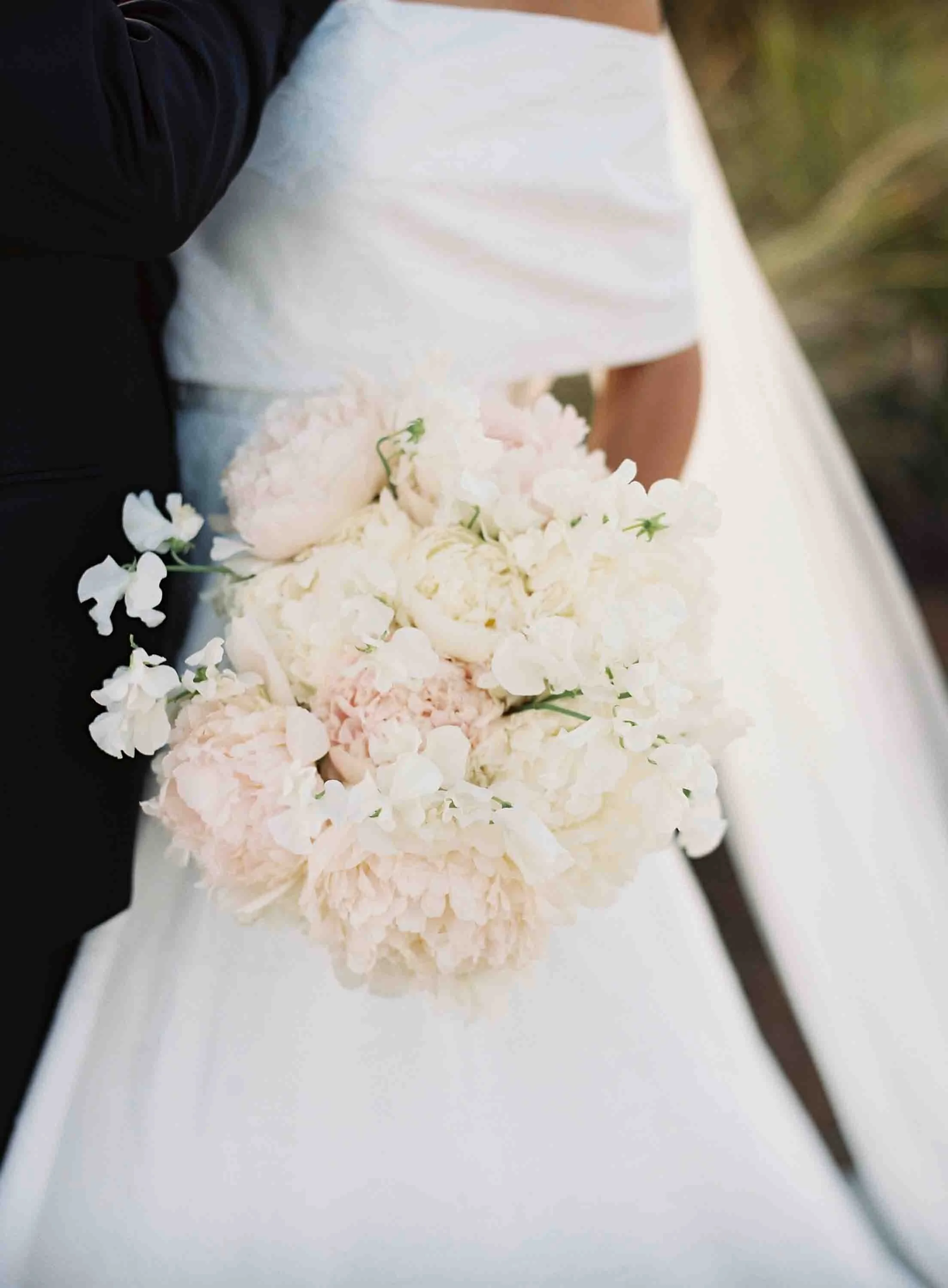 Soft pastel bridal bouquet with peonies and delicate florals at a Kiawah Island wedding