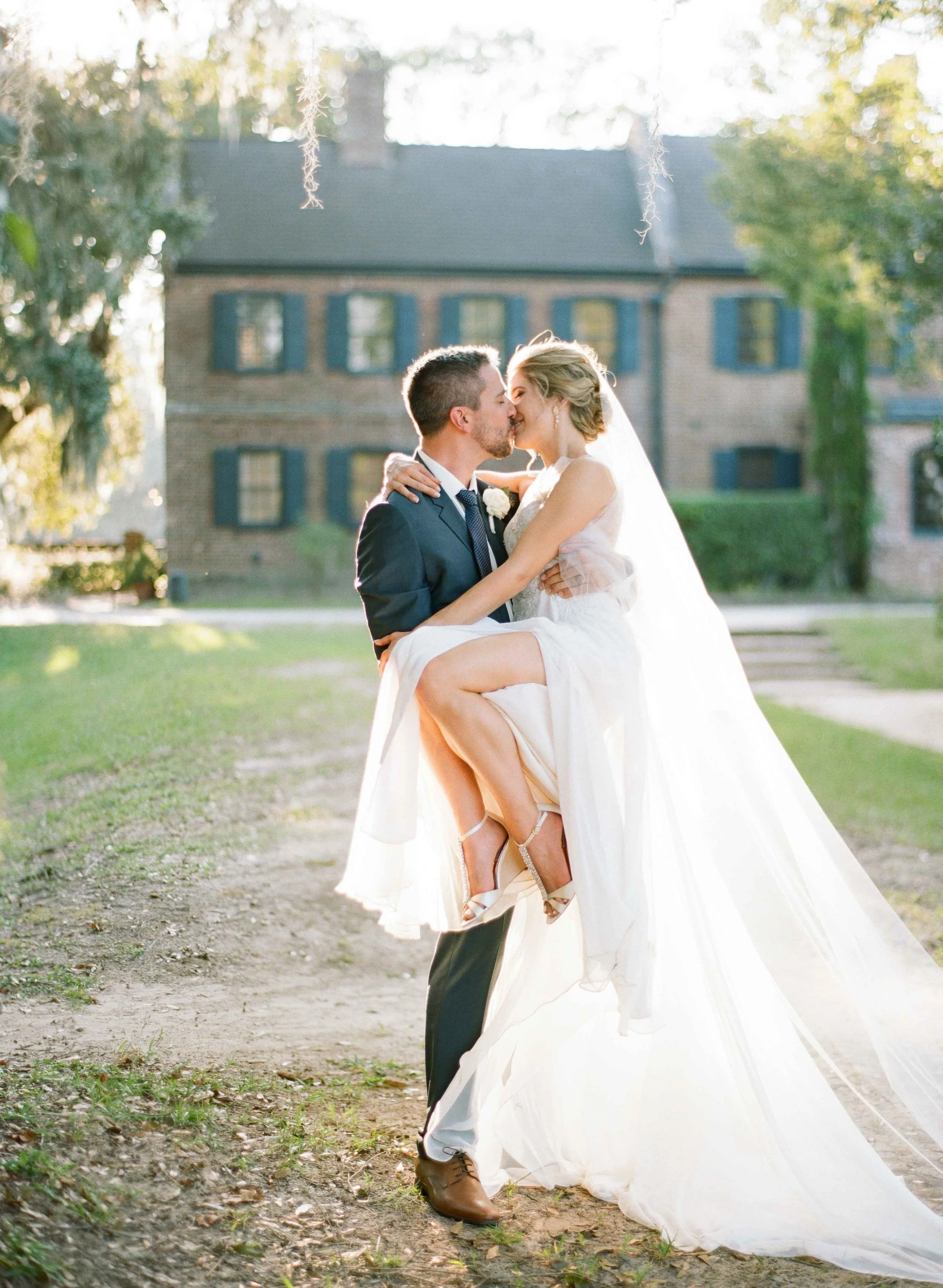 Bride and groom portrait behind Middleton Place main house