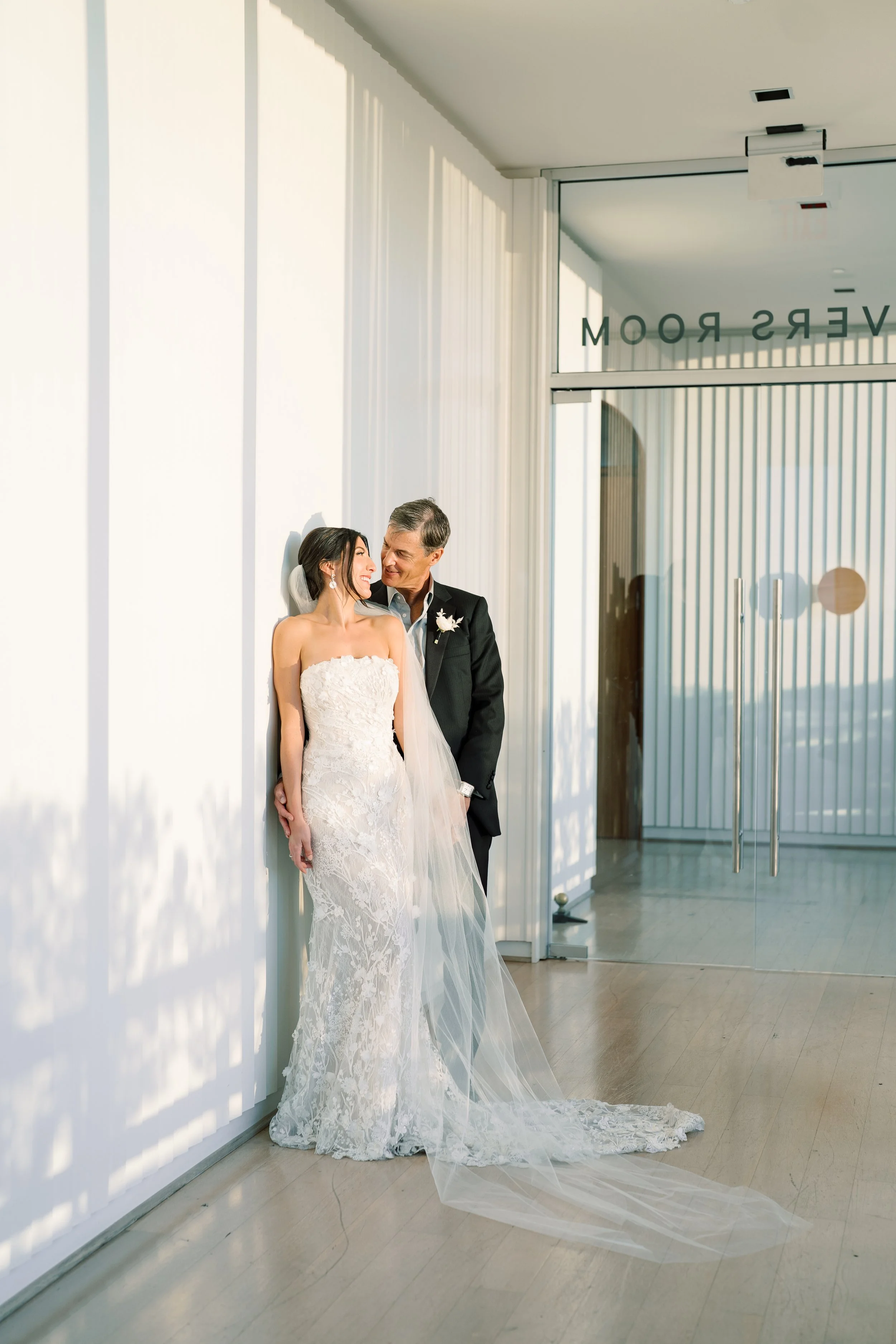 Wedding couple portrait inside The Dewberry Hotel in Charleston South Carolina with soft window light