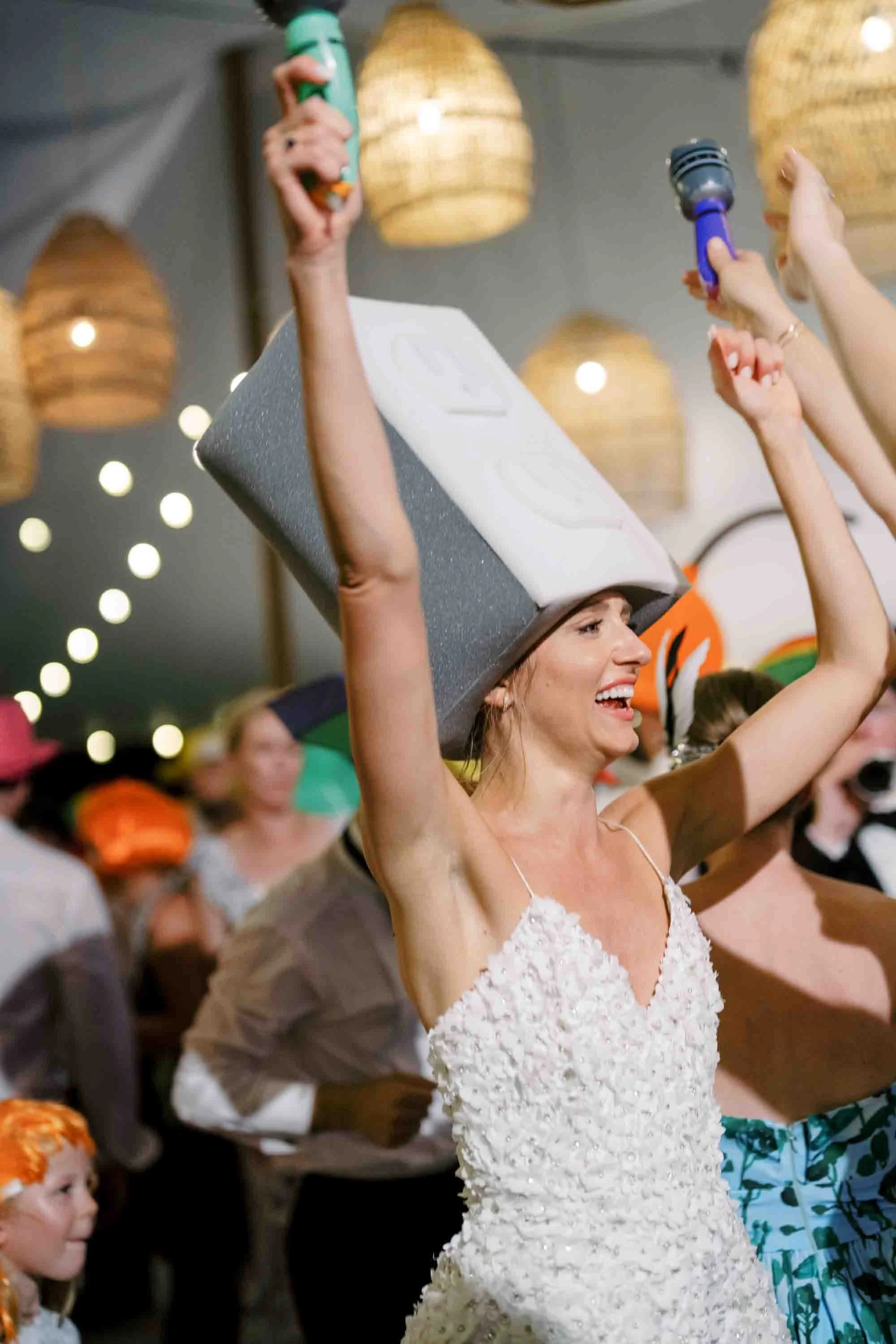 bride celebrating under a tent at an Ocean Course wedding reception