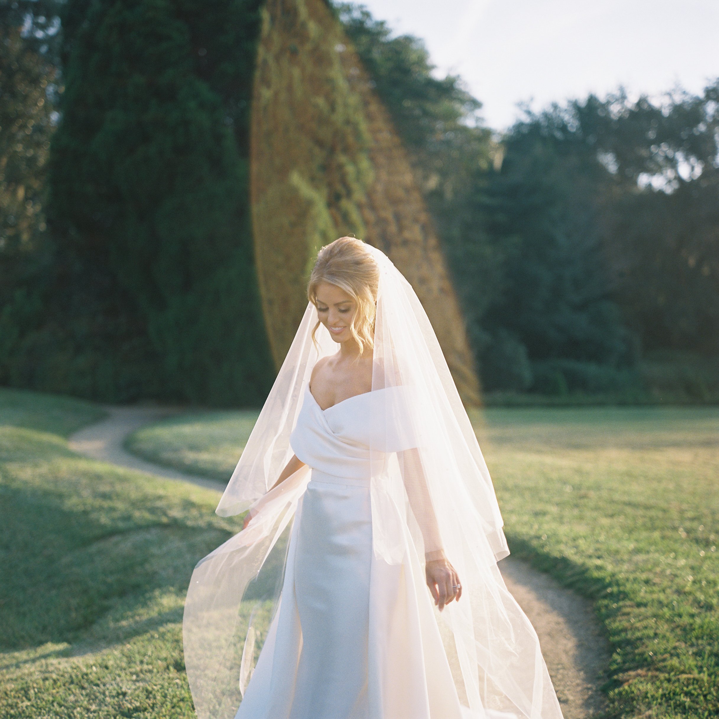 Bridal portrait of Rachel Wyatt at Middleton Place Plantation in Charleston South Carolina with soft natural light