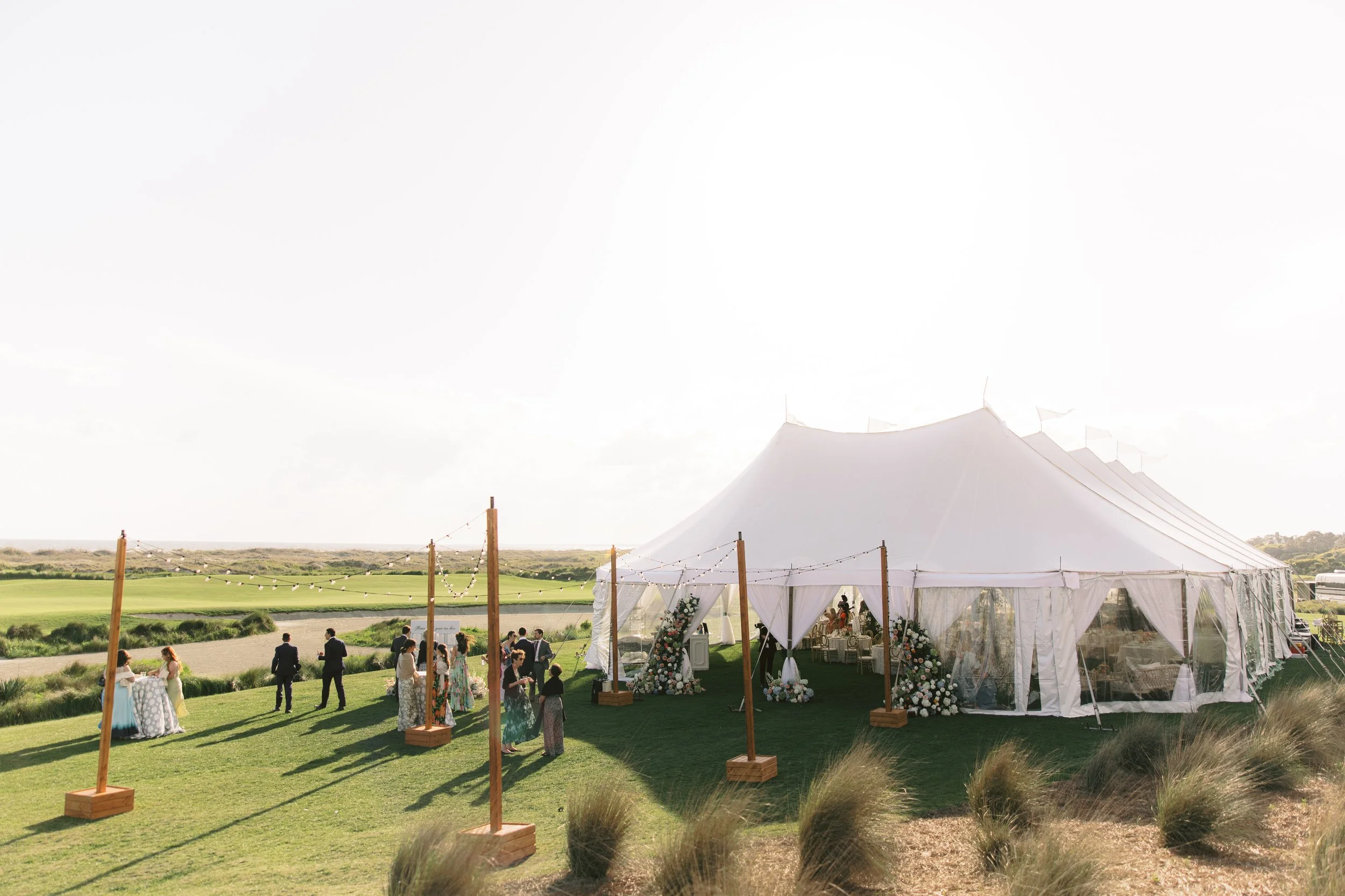 Fine art film wedding reception in a tent at Kiawah Island Ocean Course