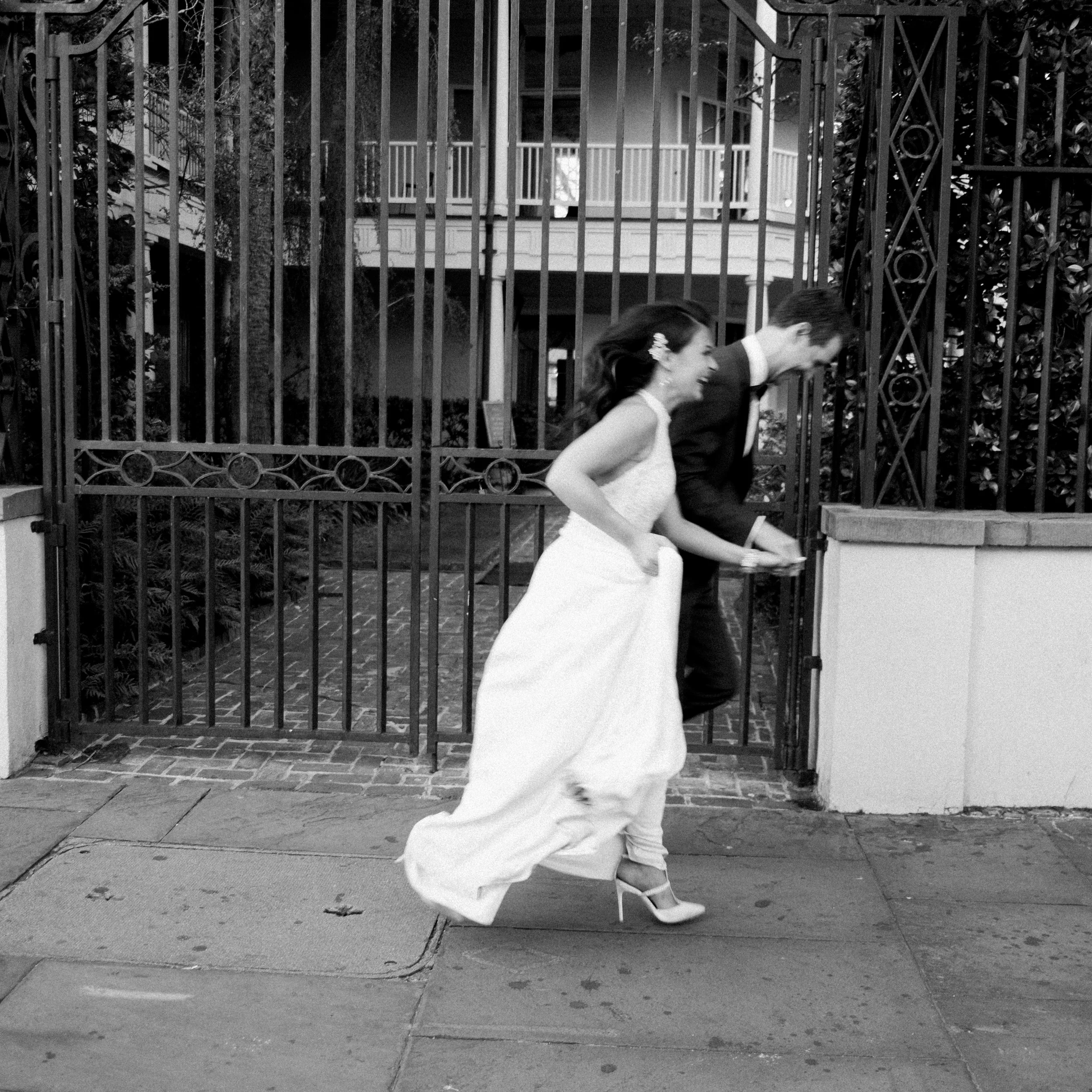 Bride and groom exit their ceremony at William Aiken House in Charleston, South Carolina