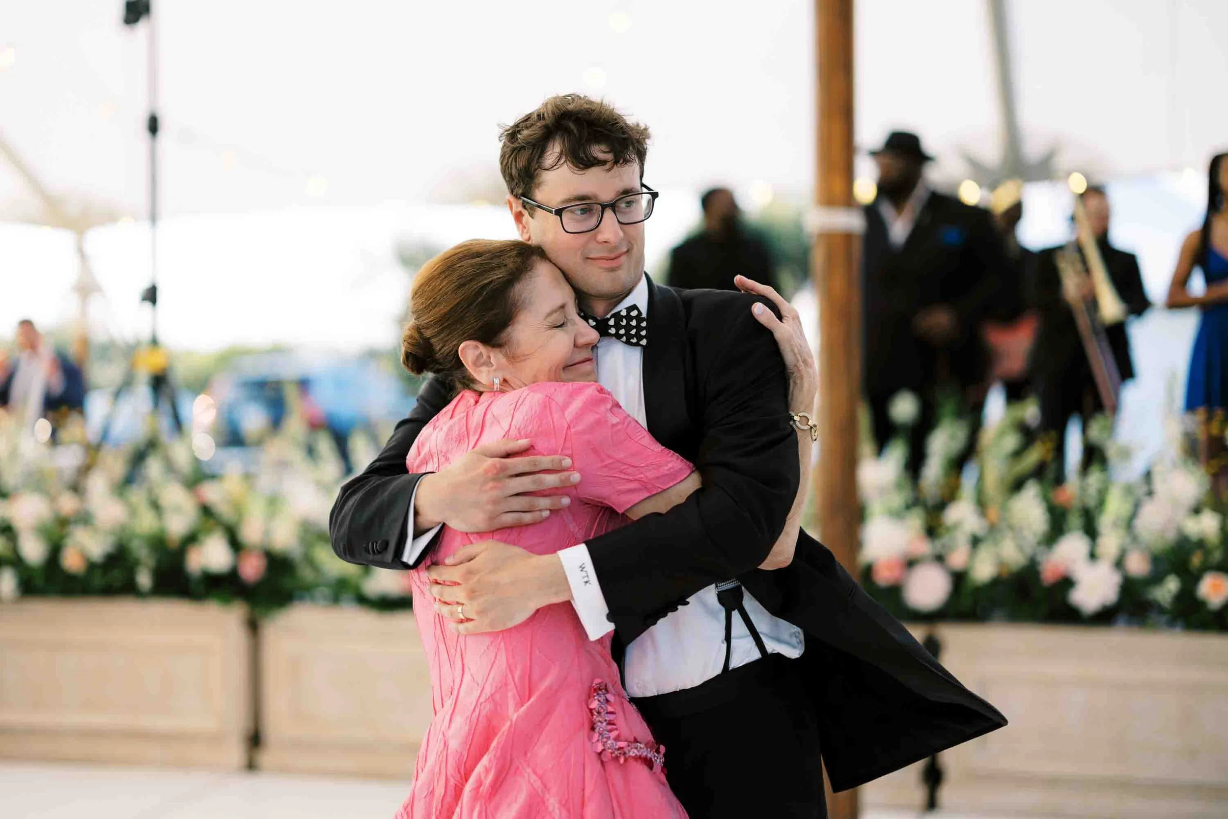 mother and son dancing during a heartfelt moment at a Kiawah Island wedding reception