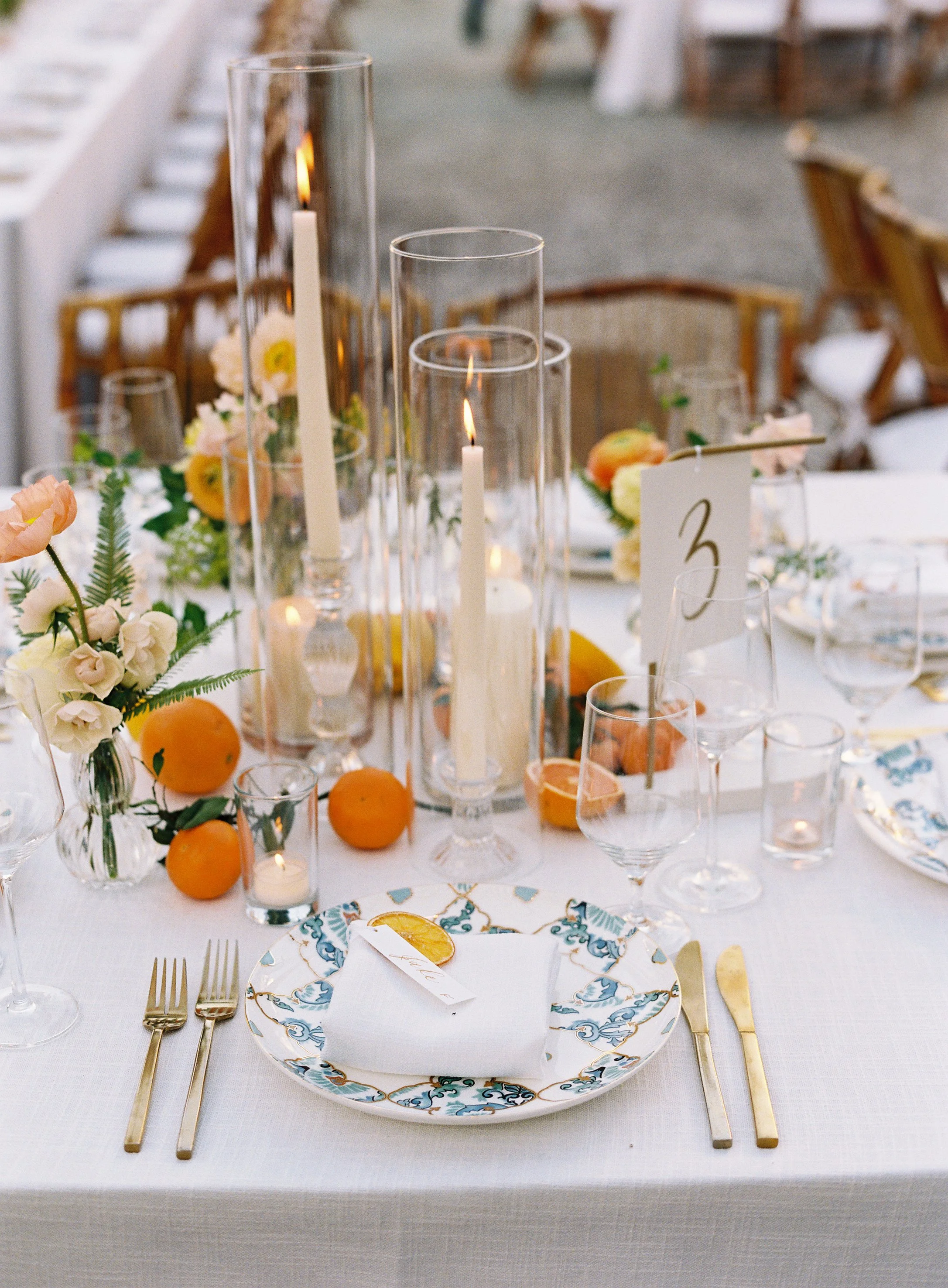 Reception tablescape with candles and citrus details at William Aiken House wedding in Charleston South Carolina