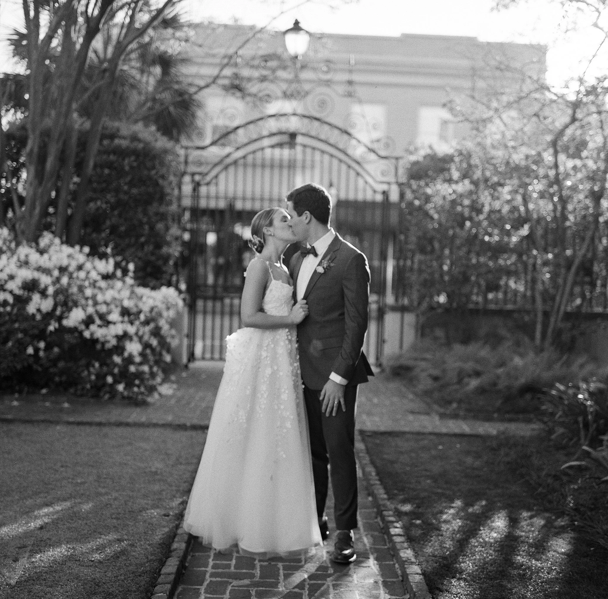 Black and white bride and groom portrait at William Aiken House in Charleston, South Carolina