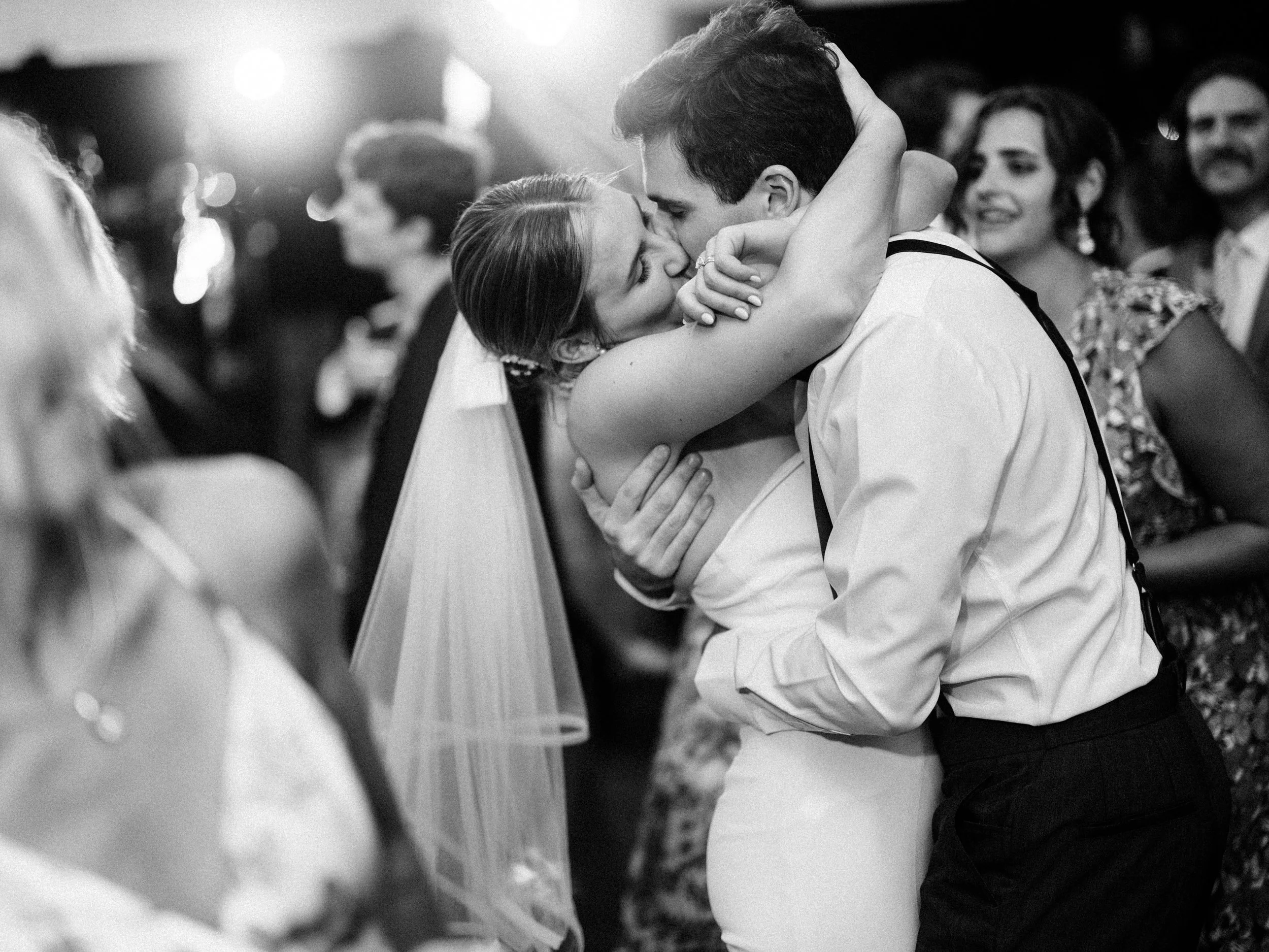 bride and groom share an emotional moment on the dance floor during their wedding at the William Aiken House