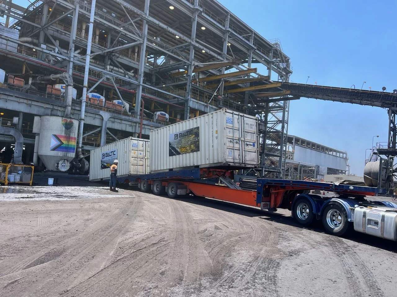 Industrial site with shipping containers on trailer