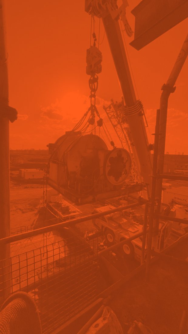 Heavy machinery on a construction site with an orange color filter