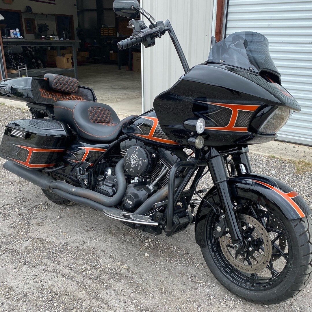 Custom paint job with orange candy and carbon fiber graphics