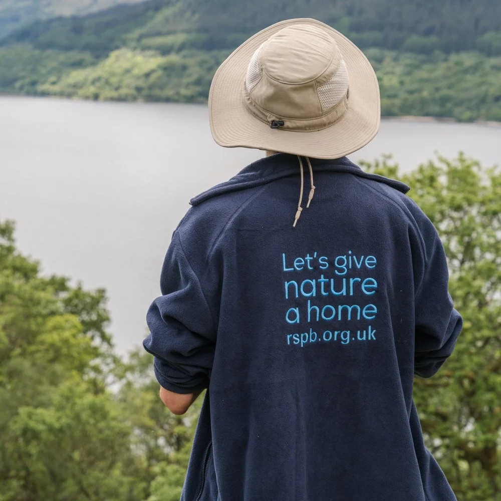 RSPB Ranger looking out over Loch Lomond