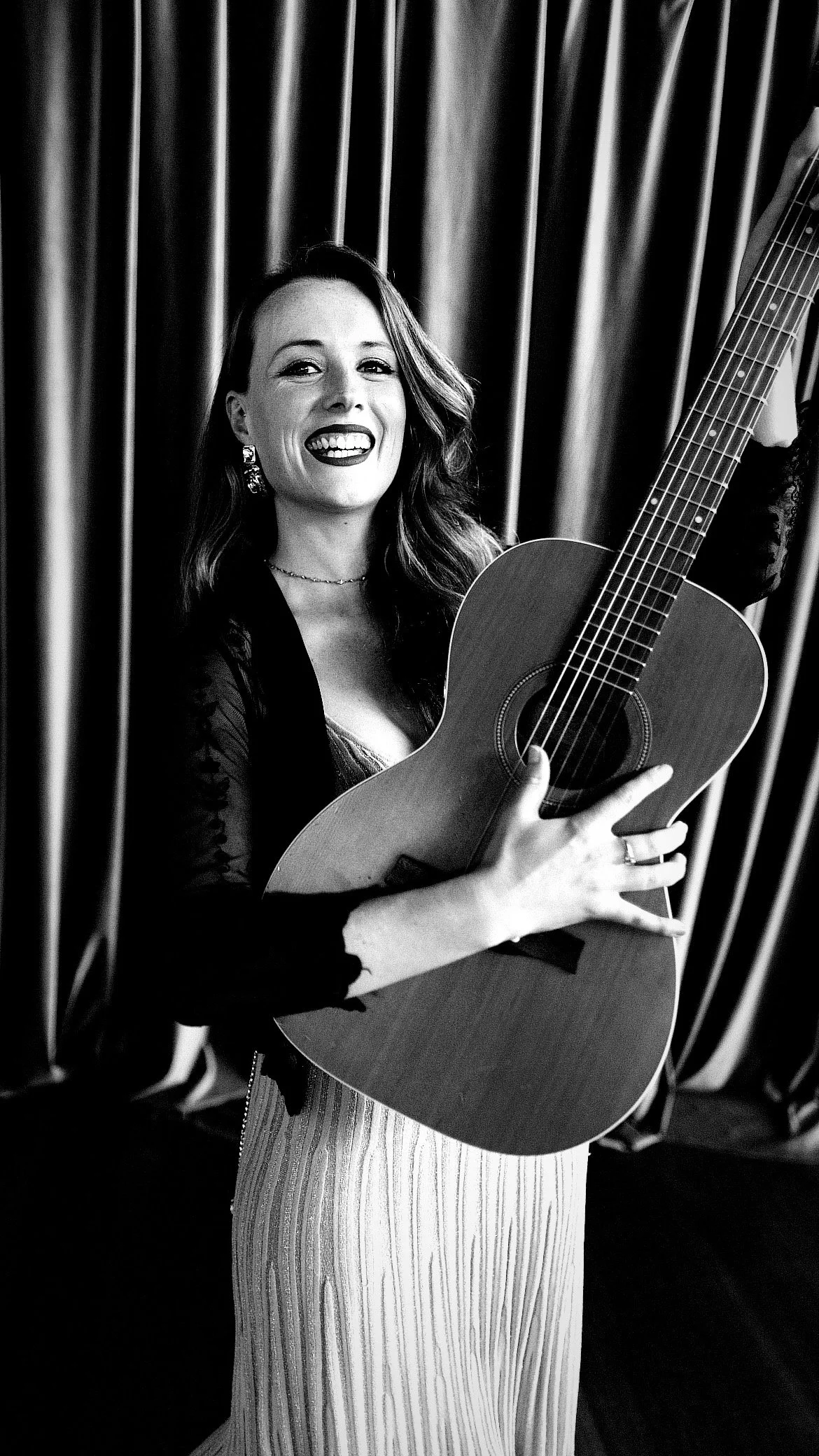 Erin holding a guitar