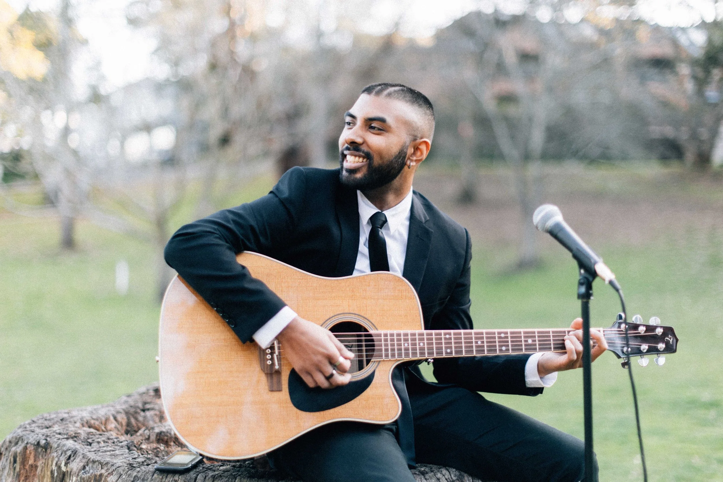 A man holding a guitar