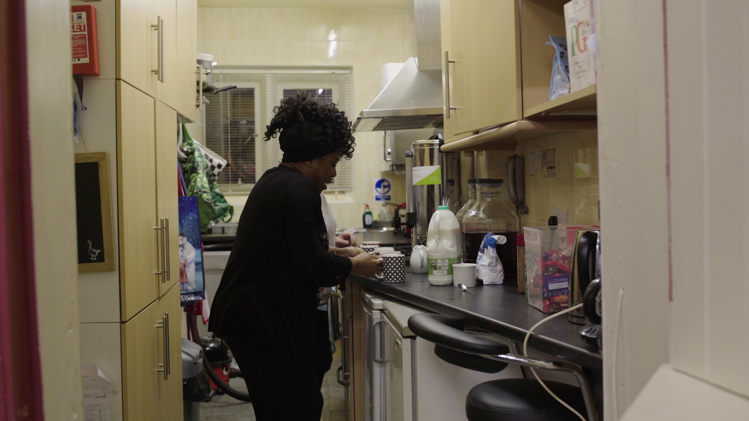 A woman makes a range of hot drinks in the kitchen, Warwick Bereavement Group
