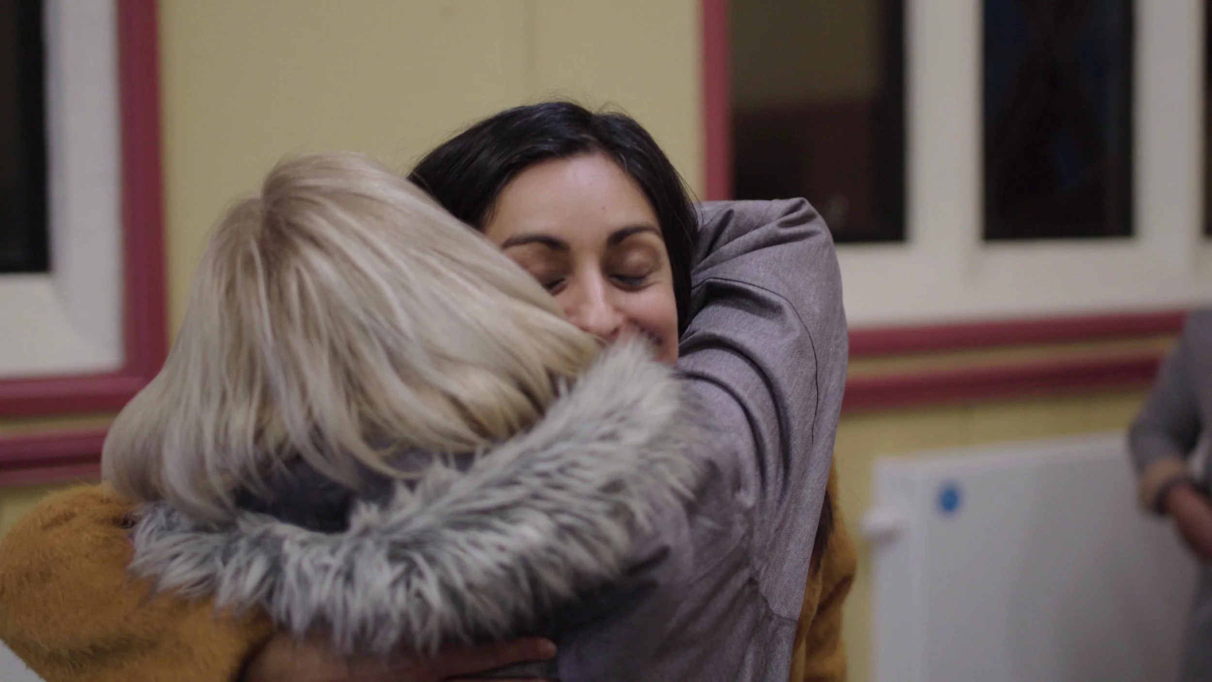 Two women embrace, Warwick Bereavement Group
