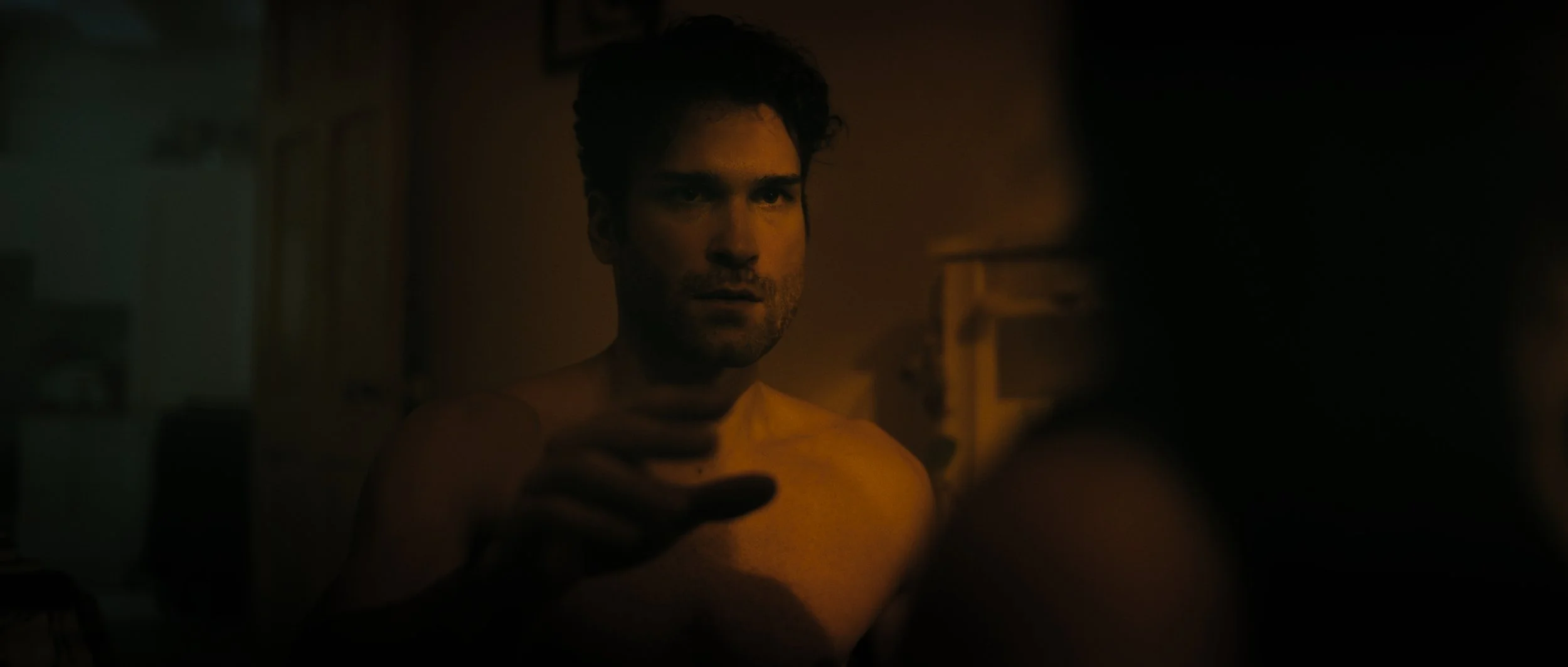 A man in bed reaches his hand towards the shoulder of a women in shadow, Night Whispers