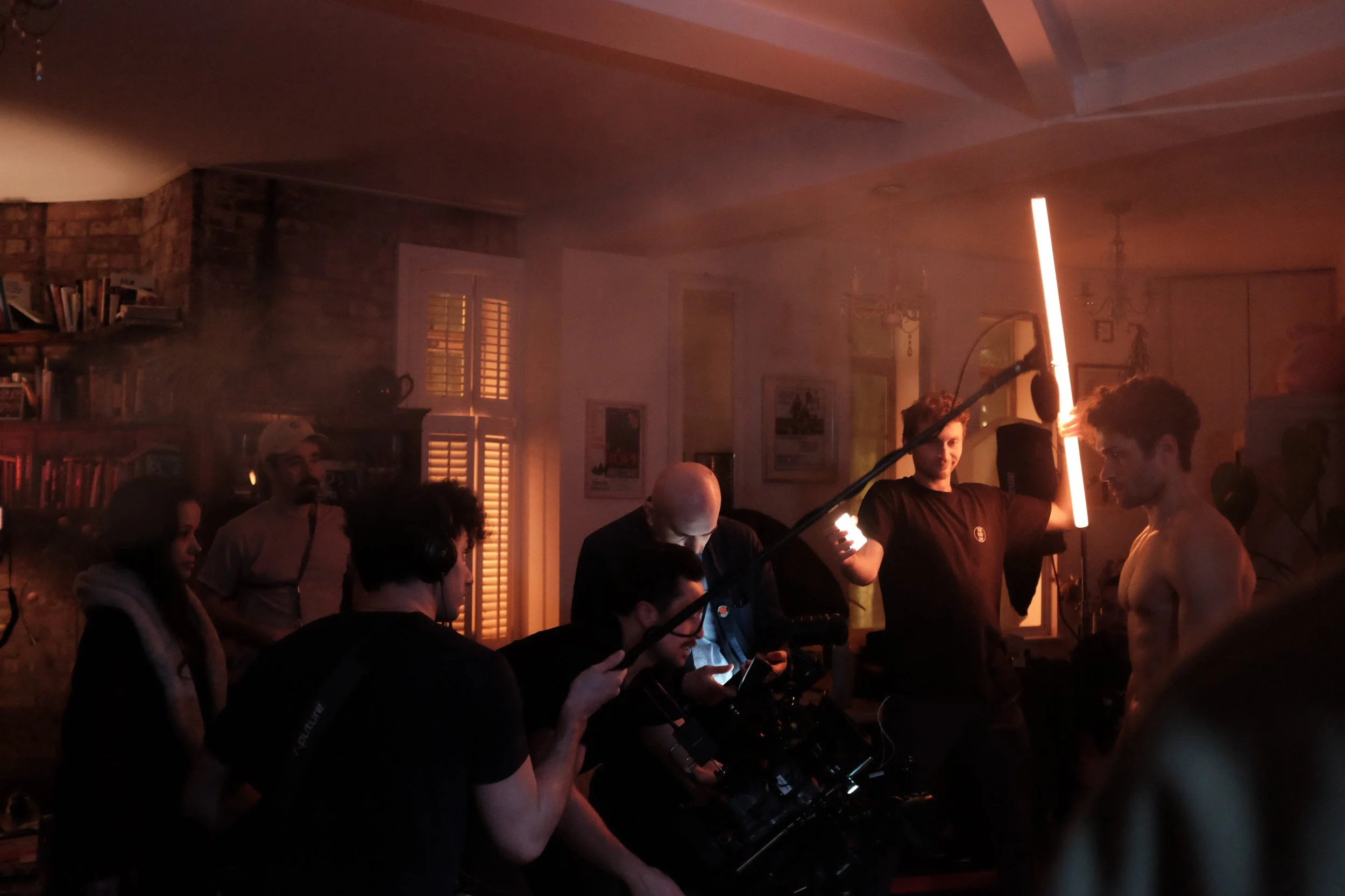 A group of cast and crew get ready to the next shot on the set of Night Whispers
