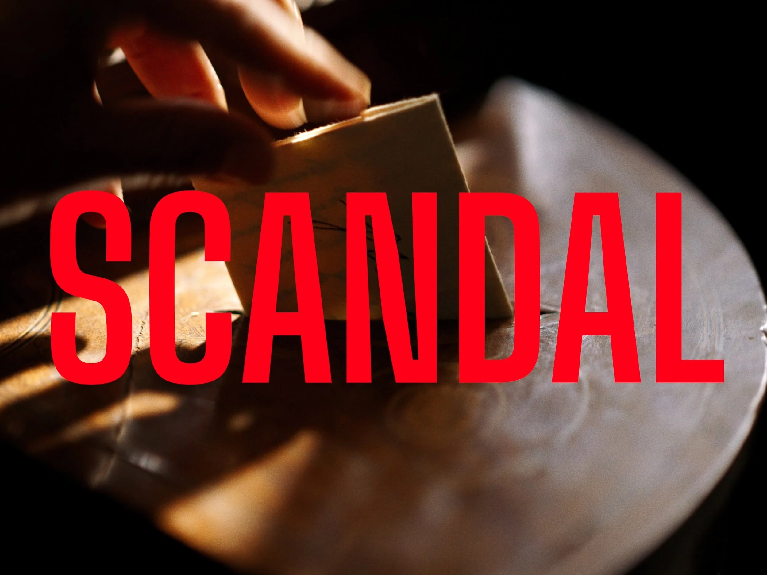 A hand places an envelope into a secret compartment in a desk as sunlight streams across the wood, The Secret Life of Props