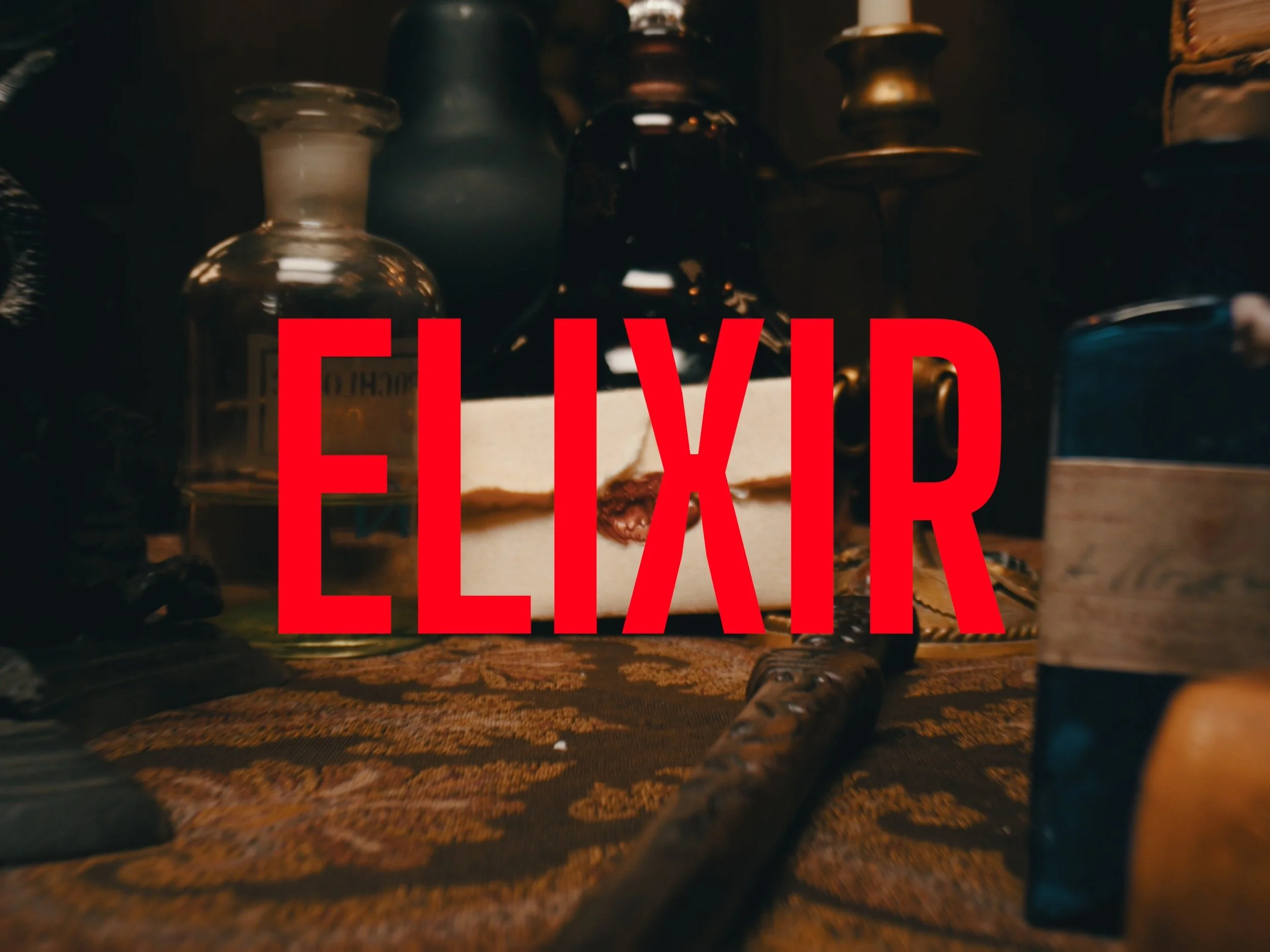 A letter sits against a bottle with a magic wand in the foreground, The Secret Life of Props