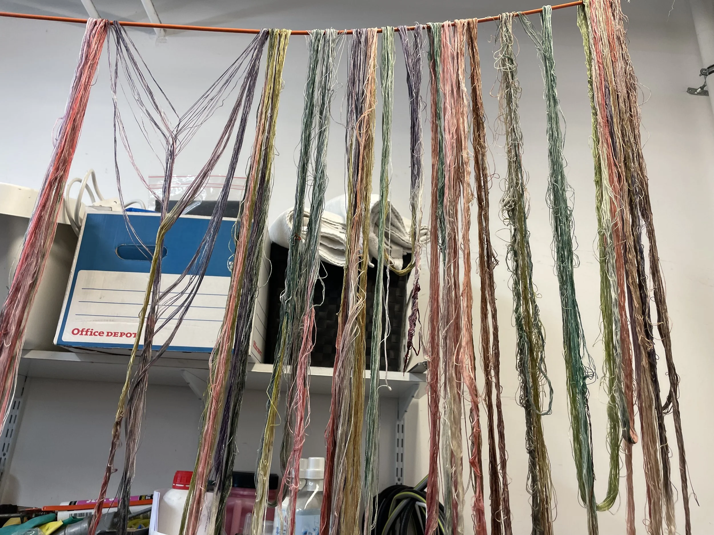 Digitally printed warps hanging up to dry