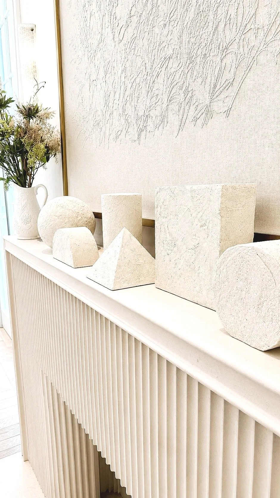 Phillip Jeffries textured white wallcoverings and objects displayed at WOW!house