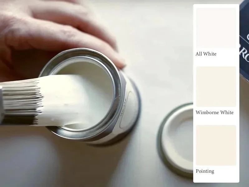 Farrow and Ball white paint pots and colour cards showing All White, Wimborne White and Pointing undertones