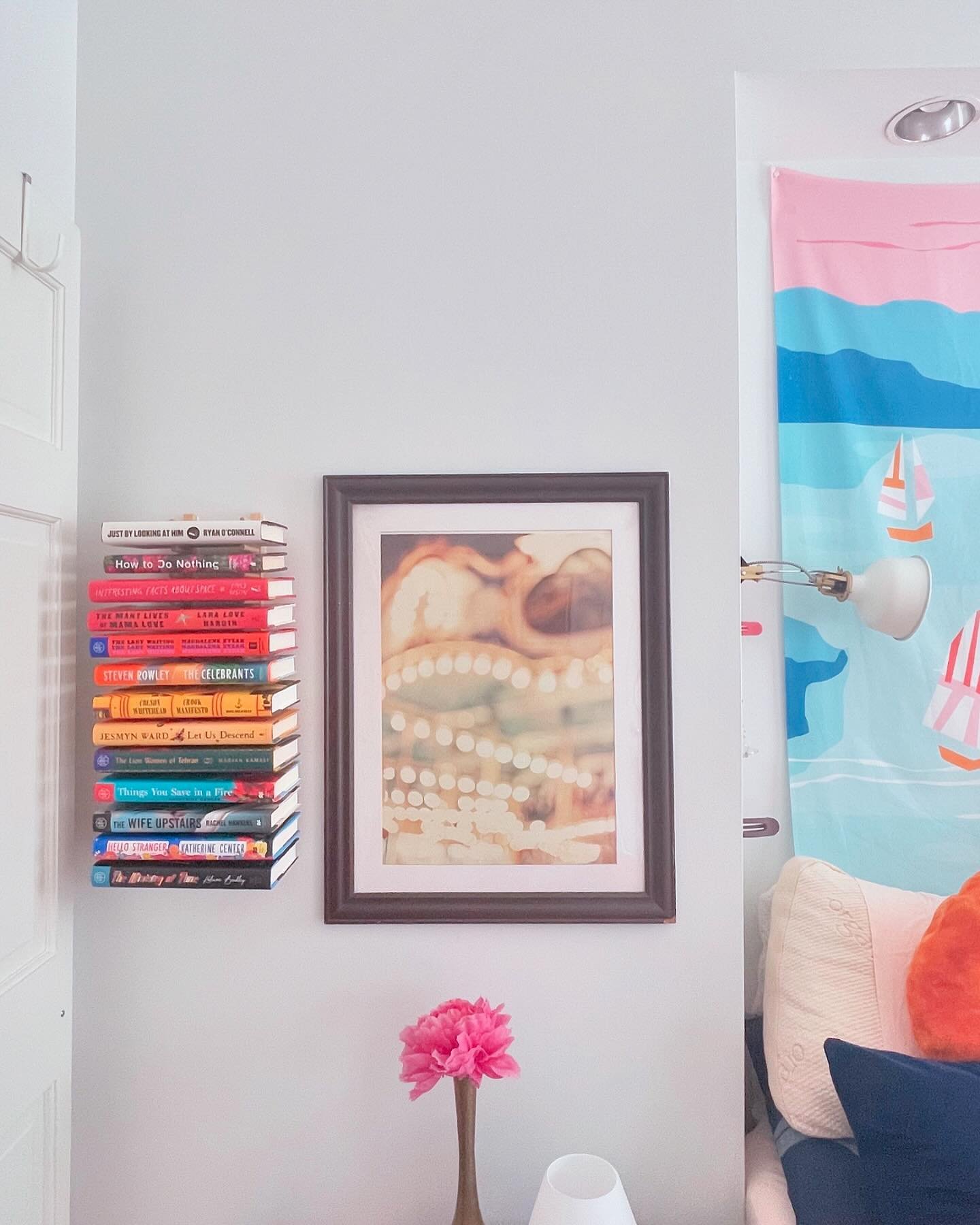 Took a page 📖 from @grillodesigns and used an @ikeausa OSTBIT dish rack as a floating bookshelf. Those 🌈-spined @bookofthemonth  look great, don&rsquo;t you think? #smallspaces #diyhomedecor