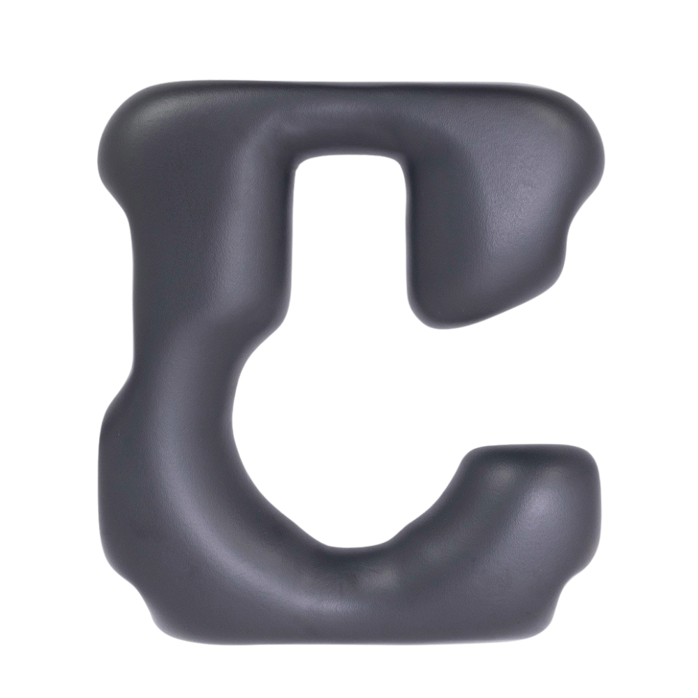 A black plastic shower commode seat shaped like a horseshoe.