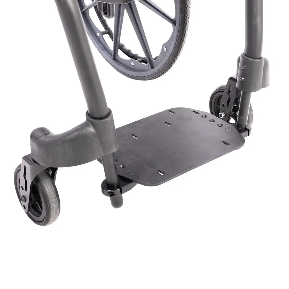 Close-up of a shower commode's base, showing two front wheels, a black footrest, and part of the frame.