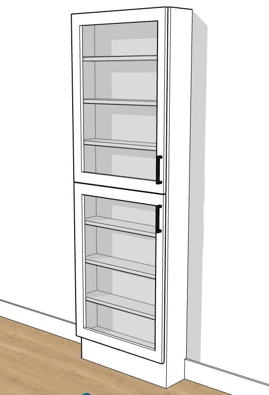 A white kitchen pantry with two glass-paneled doors and black handles, placed against a white wall on a wooden floor.