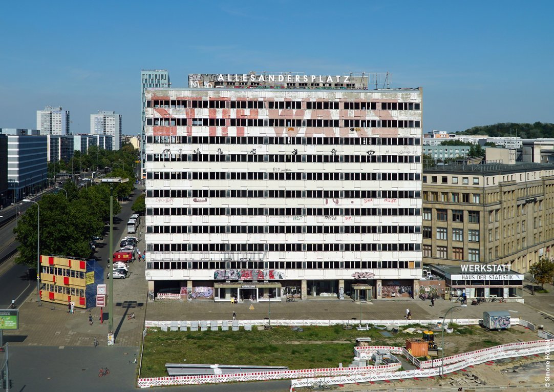 Front of Haus der Statistik, an abandoned building in Alexanderplatz, Berlin with the lettering “Allesandersplatz” (“everything different- square”) written on top