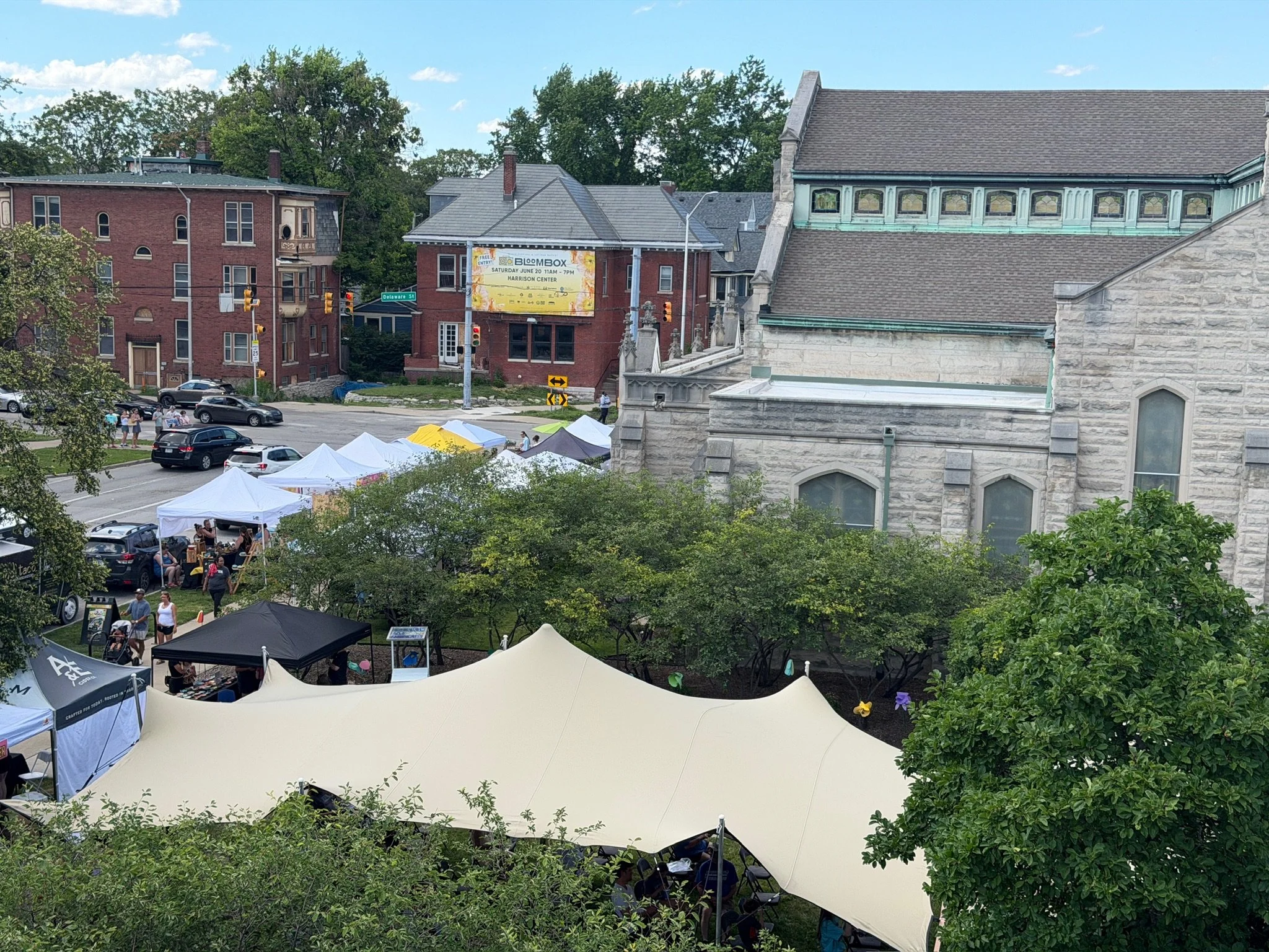 Chino stretch tent from Tensus Stretch Tents, providing shade at the Bloombox Festival, an outdoor event at the Harrison Center in Indianapolis, Indiana