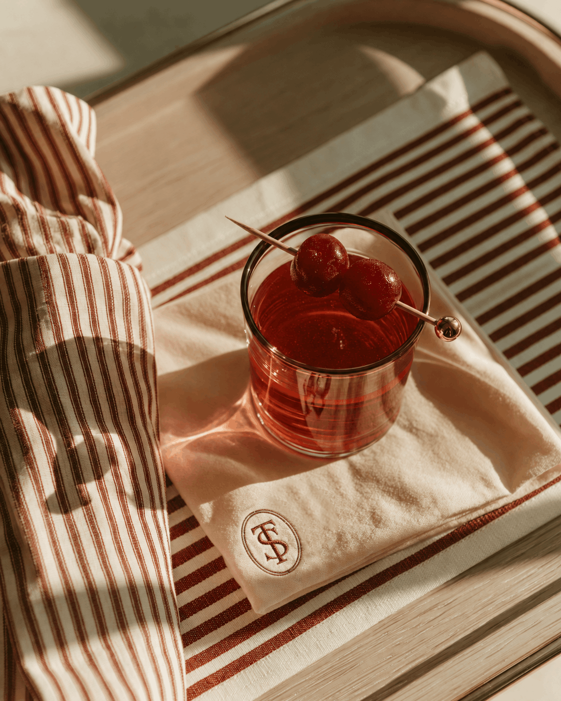 AI-designed luxury hospitality scene for The Seabrook showcasing branded linens, cocktail styling, and refined lifestyle creative direction for a conceptual country club.