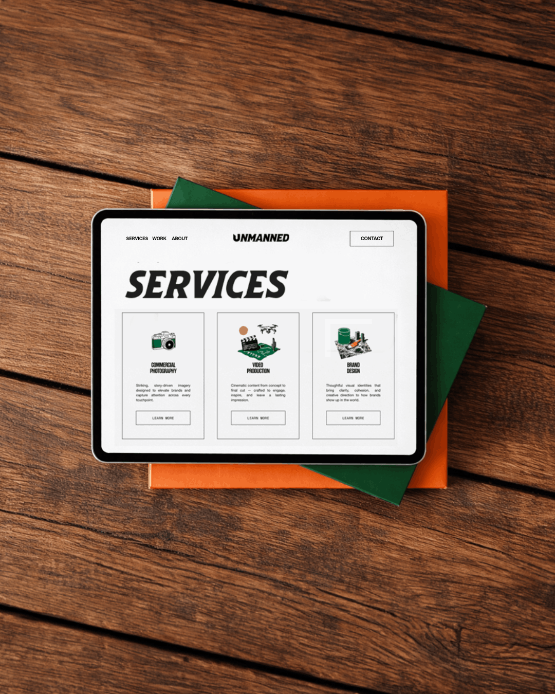 Responsive website design for a creative marketing agency displayed on a tablet, showcasing service pages, custom illustrations, and a clean visual identity.