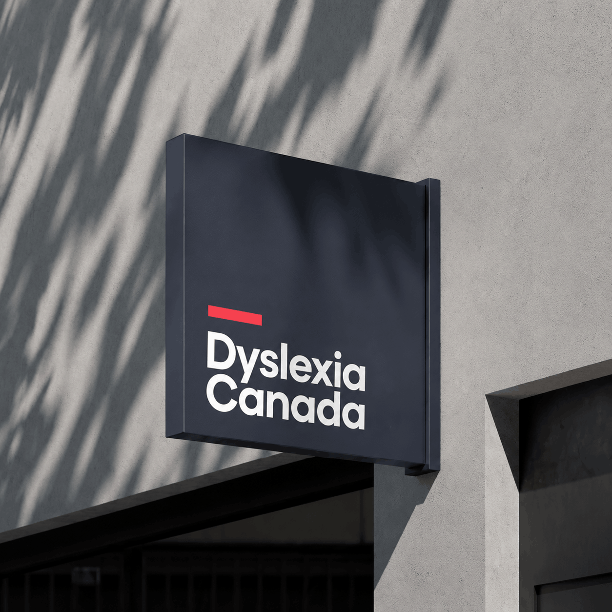 Exterior building sign featuring the refreshed Dyslexia Canada logo, demonstrating the nonprofit brand identity in an environmental application.