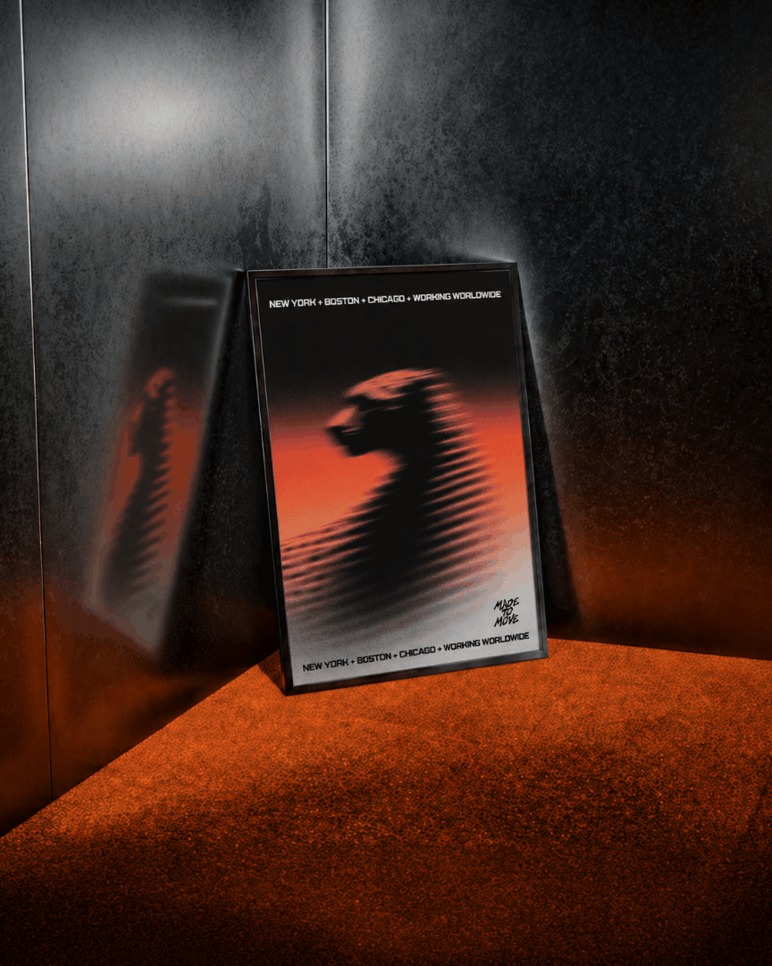 Framed poster featuring a motion-blurred cheetah graphic against a black, white, and orange gradient, displayed in a modern interior as part of a creative agency brand identity.
