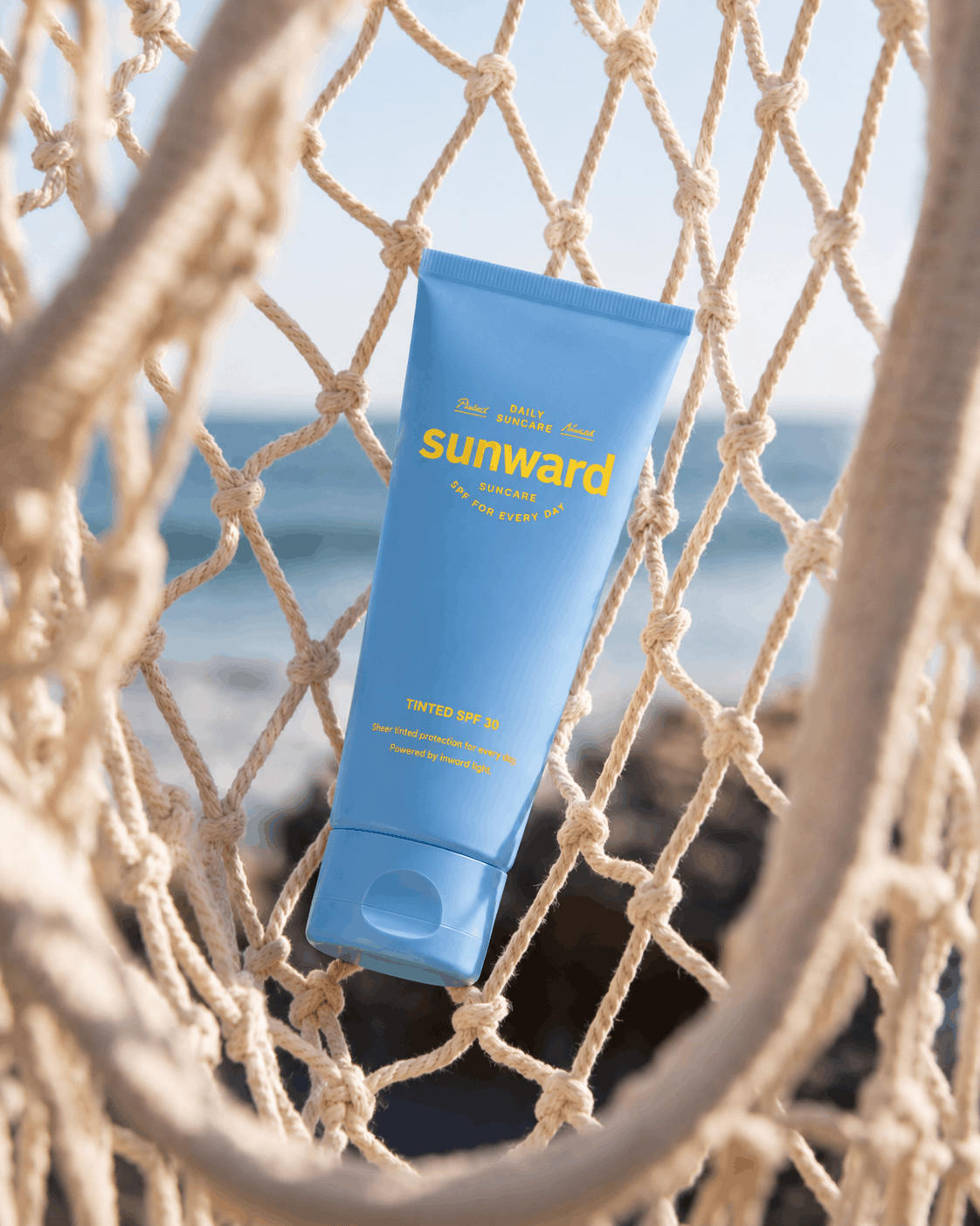 AI-generated lifestyle campaign featuring premium sunscreen packaging suspended in a beach hammock overlooking the ocean.