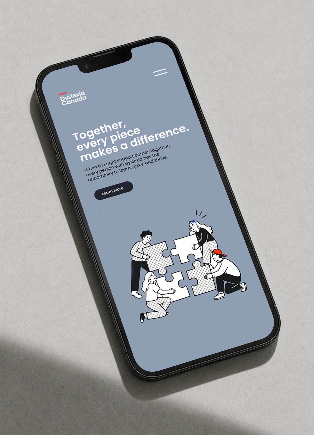 Smartphone displaying the Dyslexia Canada mobile website with custom illustrations and responsive nonprofit web design.