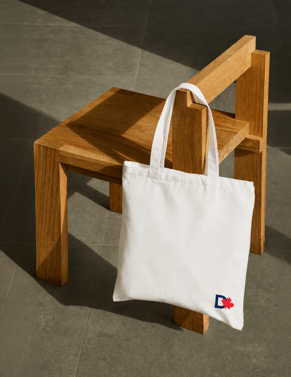 Canvas tote bag featuring the Dyslexia Canada logo, showcasing branded merchandise for a national education nonprofit.