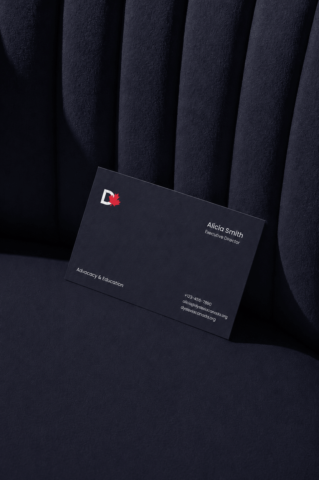 Minimal business card featuring the Dyslexia Canada visual identity and contact information for a nonprofit organization.