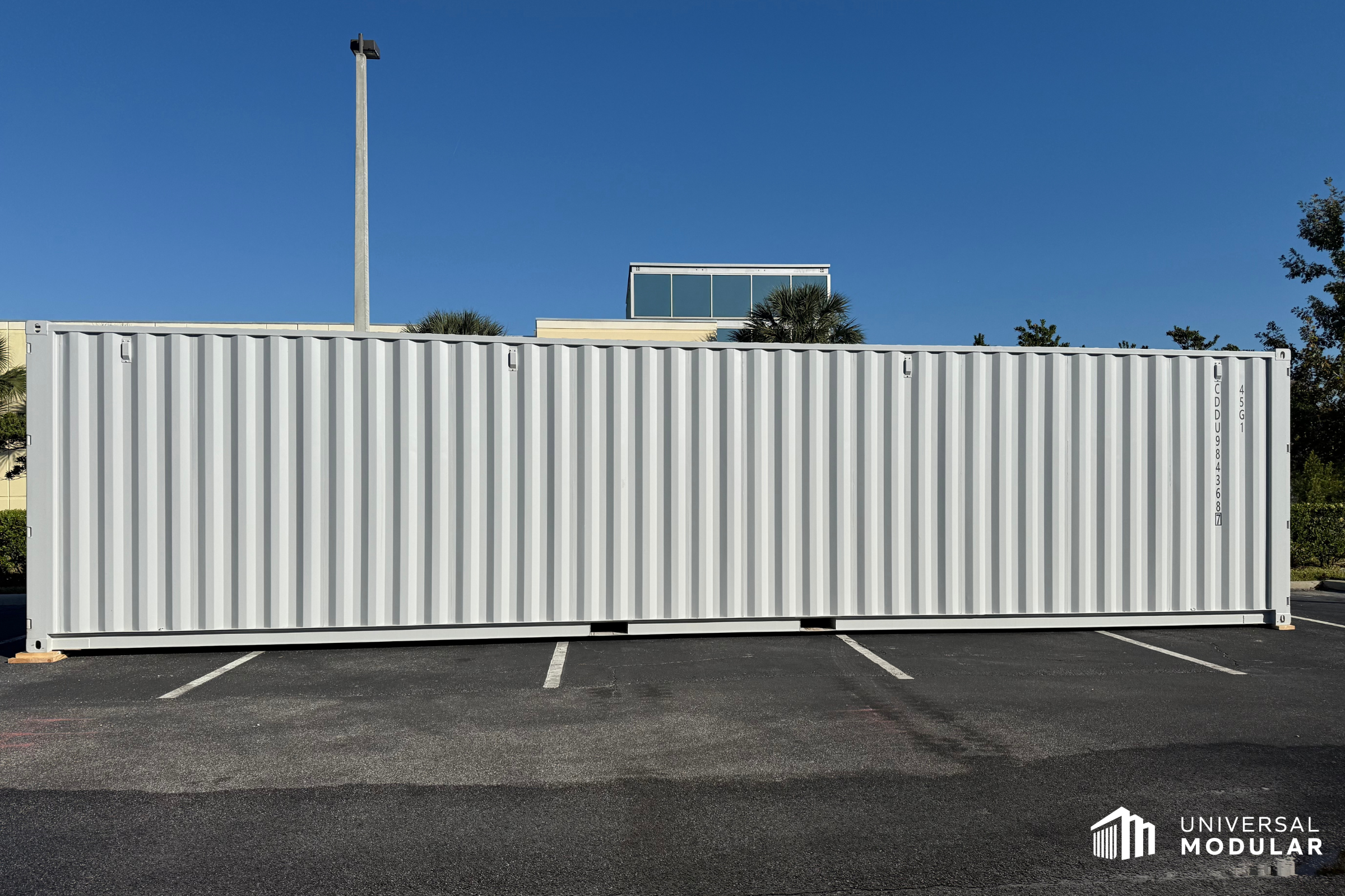 image of side of 40-foot container SCIF set in asphalt parking lot outside