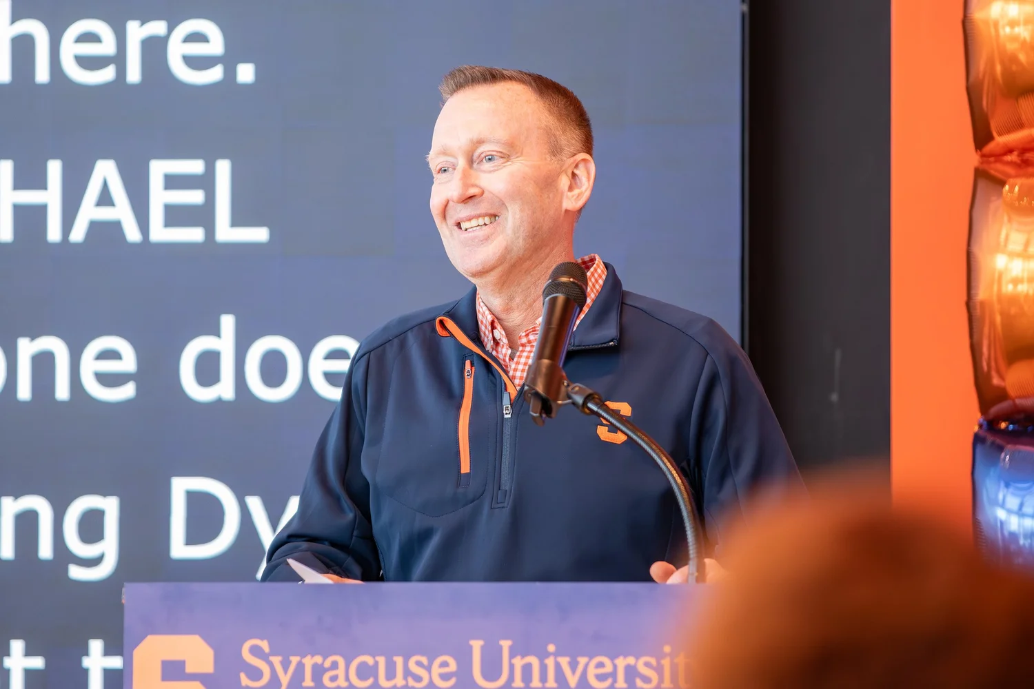 Syracuse University Vice Chancellor Mike Haynie addressing a crowd at the 'CUSE50 academic event, Event photography in Syracuse NY.