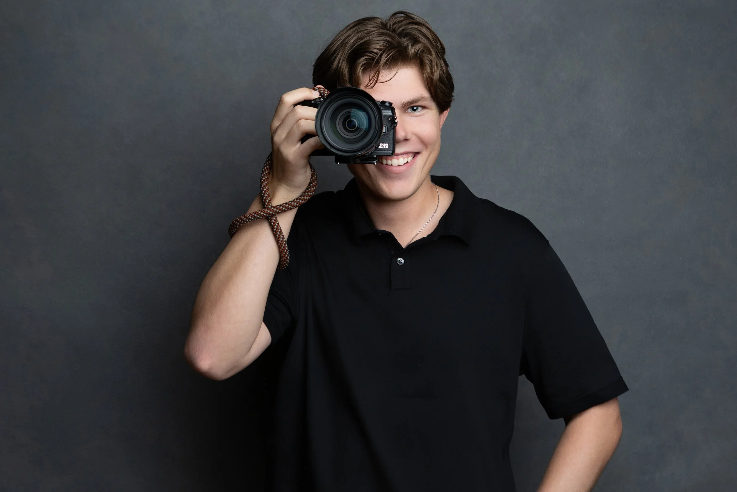 Lars Jendruschewitz horizontal headshot with camera