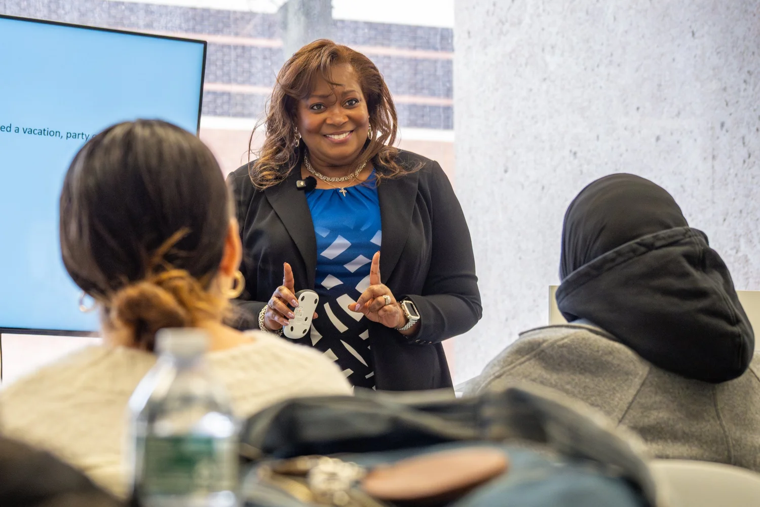 Professional speaker leading a business workshop at Syracuse University — corporate training event photography.
