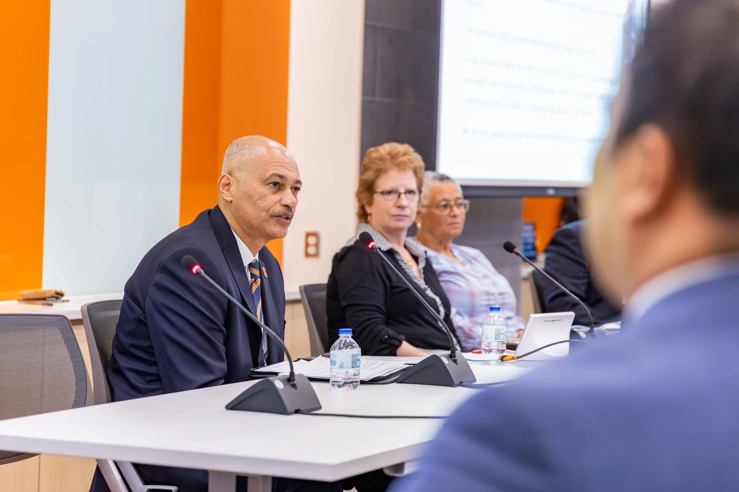 Executive panel discussion in a bright conference space — corporate event photography, Central New York.