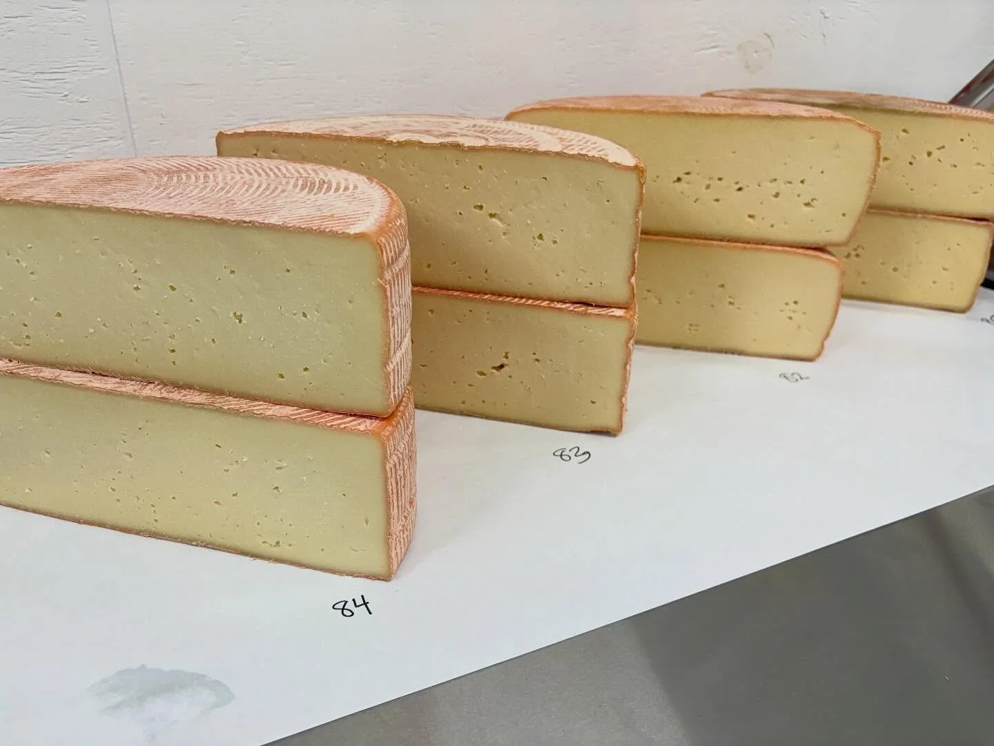 I know, I know, one more picture of cheese in a cheese making facility&mdash;white walls, stainless, and all&hellip;. But while we could do more beautiful staging, THIS is what it looks like to choose which batches of Pawlet and Rupert go to compete 