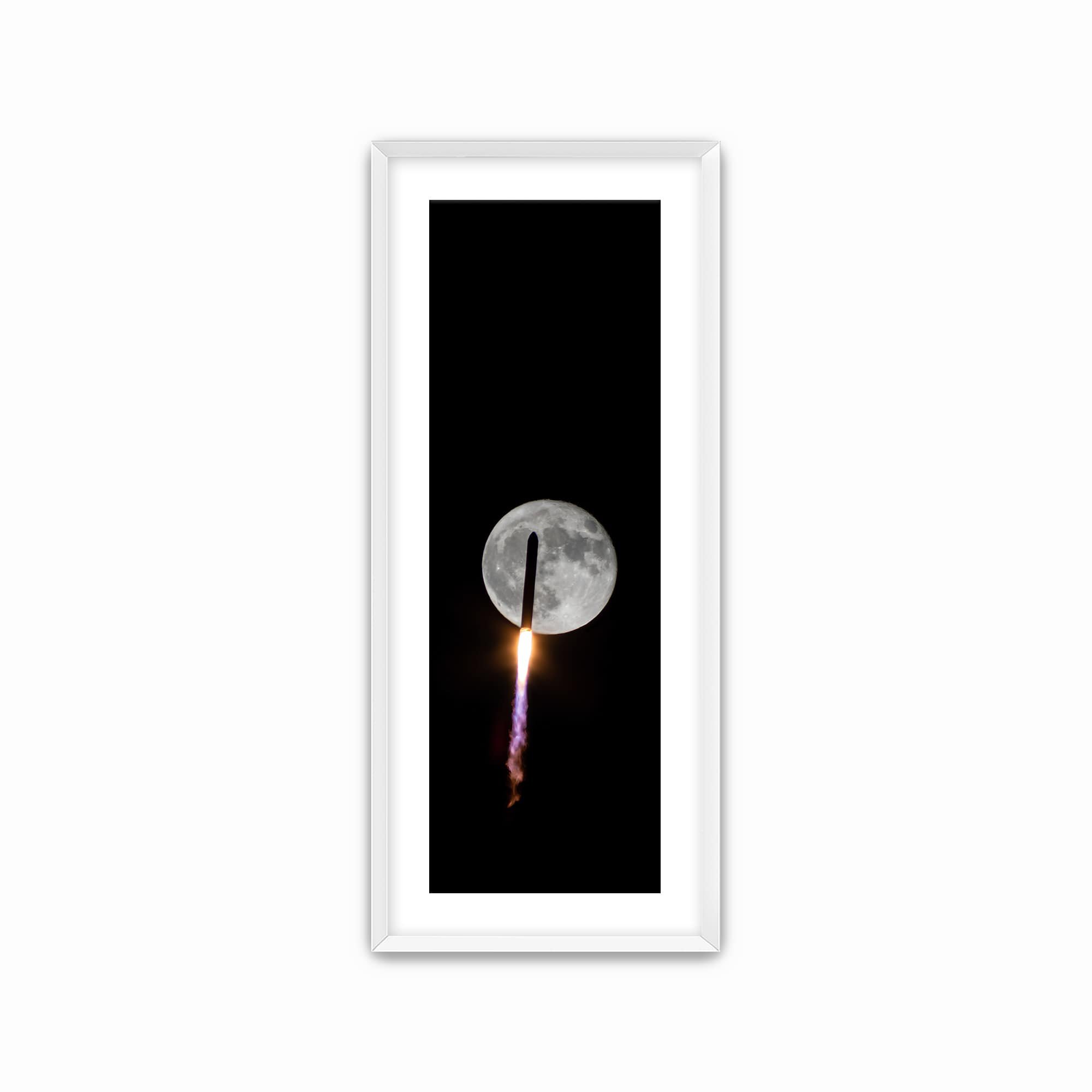 rocket flying over moon in dramatic scene print with white wood frame