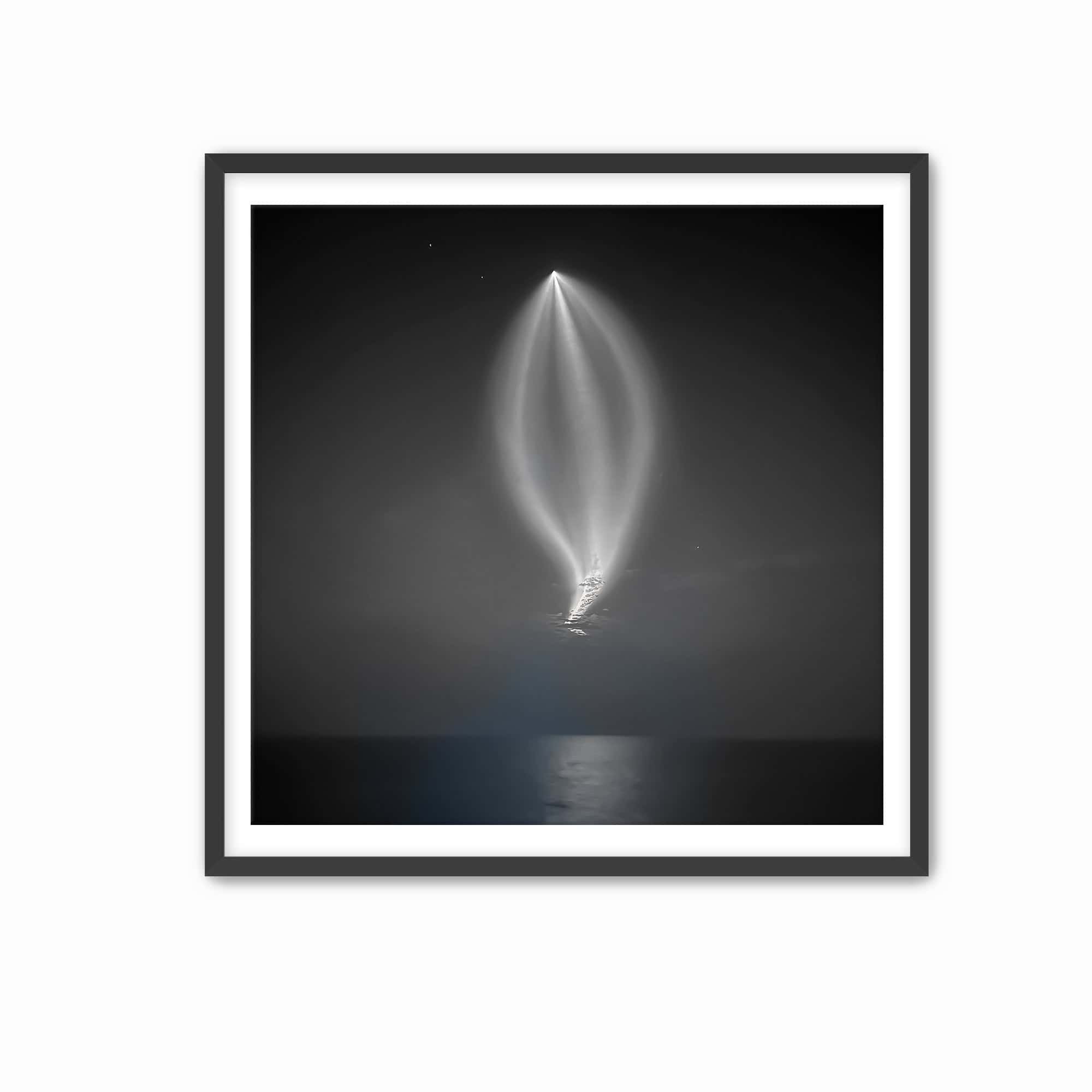 AA rocket piercing through the night sky, its trail reflecting beautifully on the ocean below print framed.