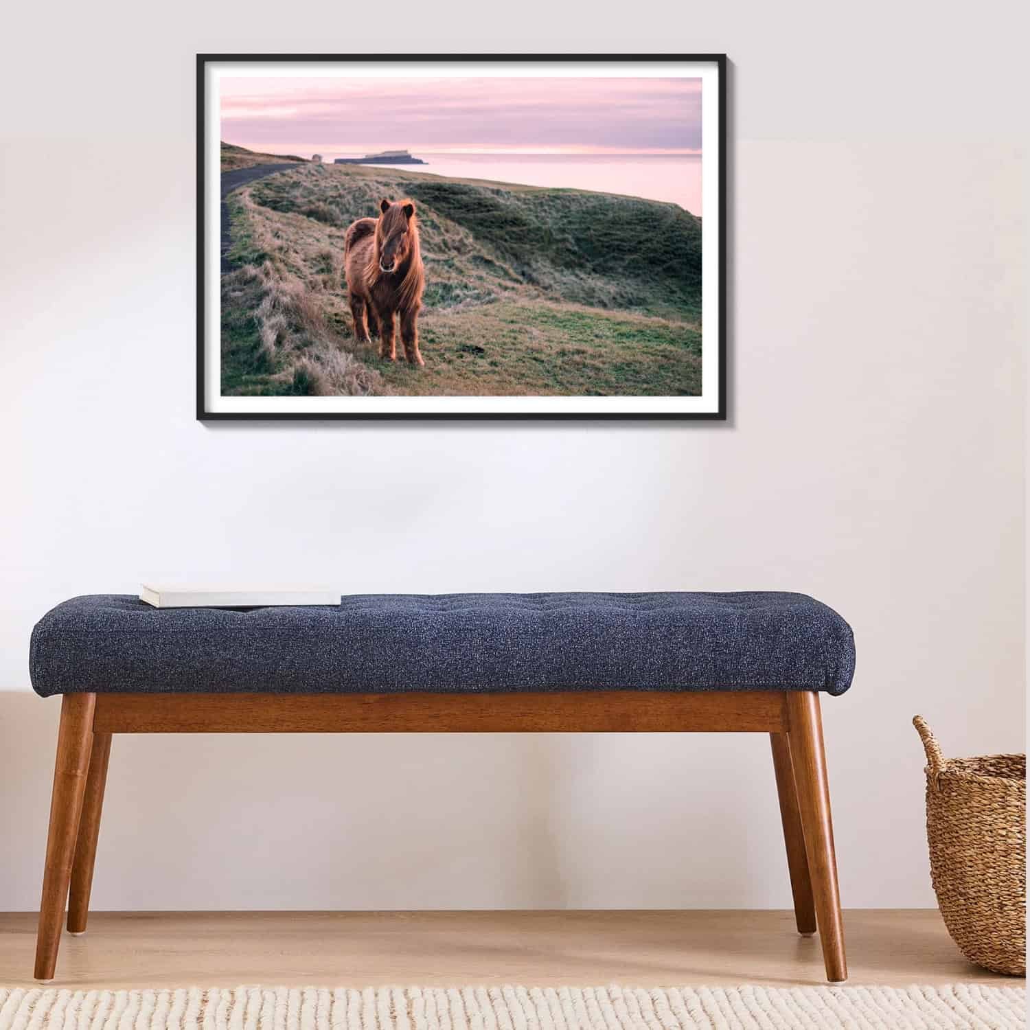 pink sunset with icelandic pony overlooking ocean