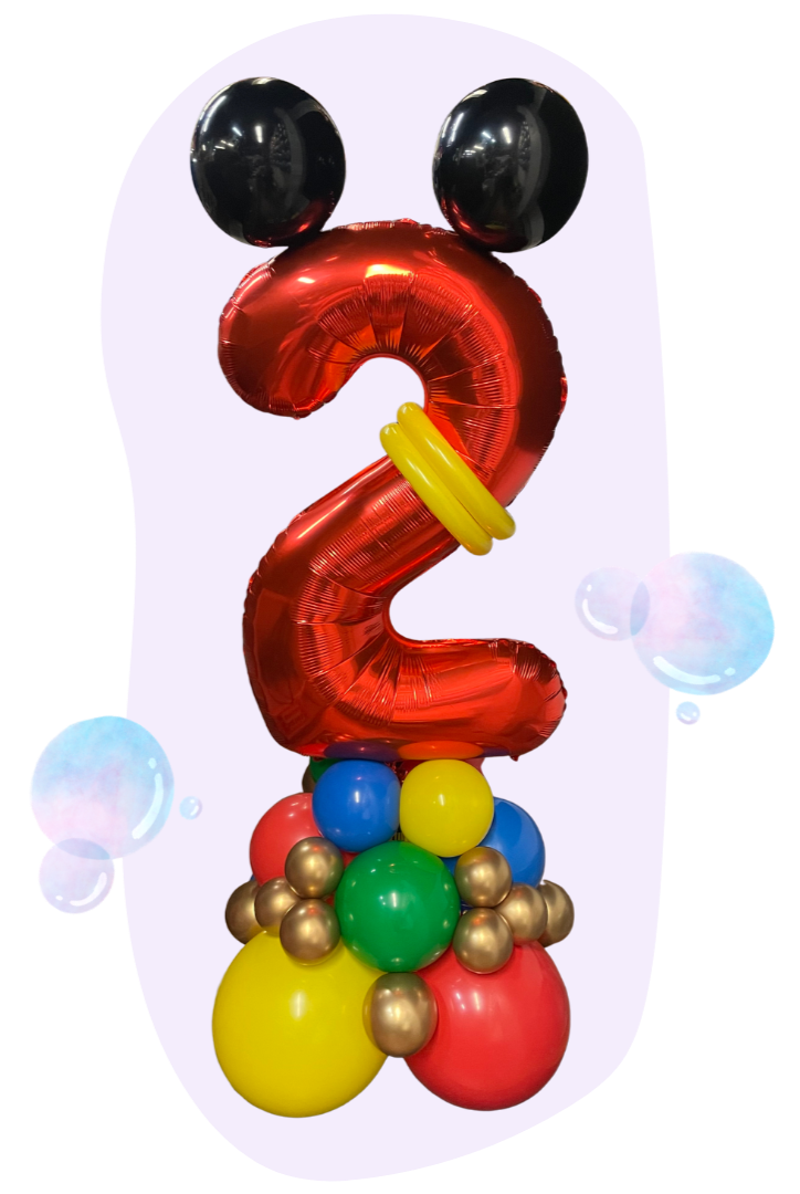 Colorful balloon arrangement shaped like a number two with eyes, resembling a face, on a light background.